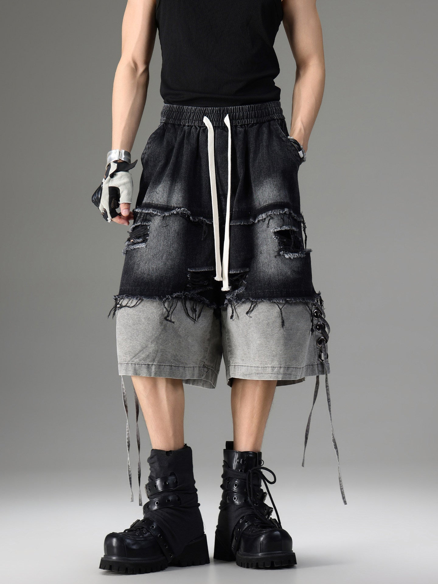 DISTRESSED RAW-EDGE PATCHWORK DENIM SHORTS
