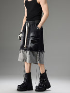DISTRESSED RAW-EDGE PATCHWORK DENIM SHORTS