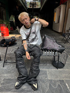 IRREGULAR STRUCTURE WAXED FLARED PANTS