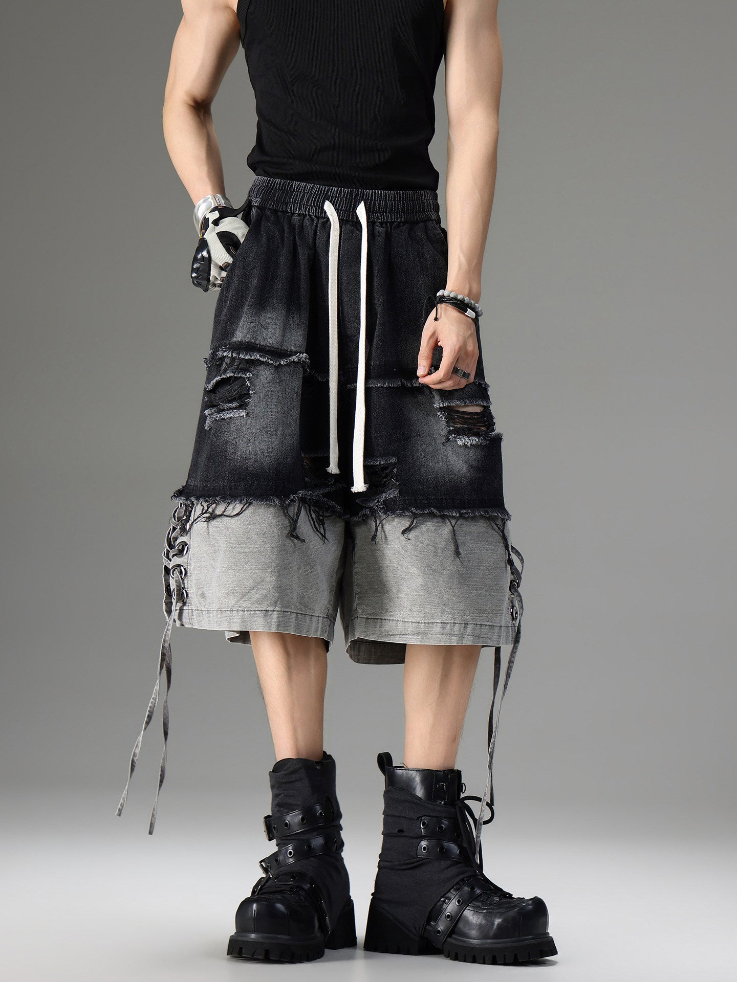 DISTRESSED RAW-EDGE PATCHWORK DENIM SHORTS