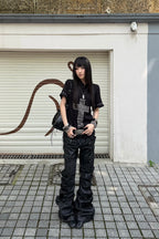 WAXED PATCHWORK STACKED STRAP DOUBLE‑WAIST CURVED SKINNY PANTS