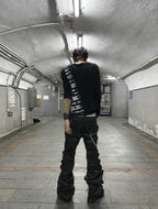 WAXED PATCHWORK STACKED STRAP DOUBLE‑WAIST CURVED SKINNY PANTS