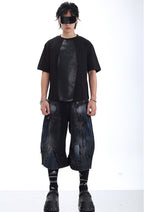 LOOSE-FIT DISTRESSED PATCHWORK CROPPED JEANS