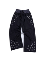 Functional adjustable-strap details define these baggy parachute pants. Lightweight smooth fabric and voluminous wide legs create dynamic silhouette for trendy techwear streetwear aesthetic.