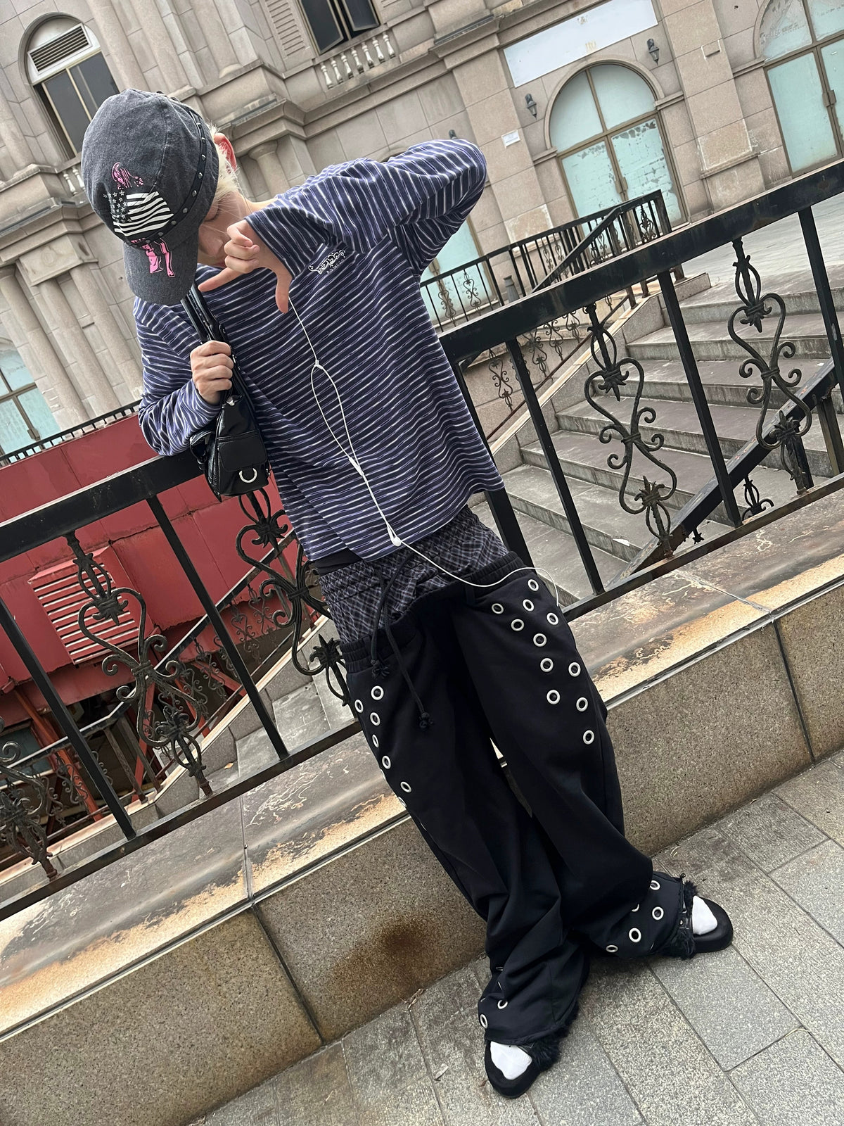 Elaborate baroque‑ornament patterns embellish this dark street fashion. Intricate swirling decorative motifs blend gothic luxury with edgy silhouettes for dramatic alternative street‑wear aesthetics.