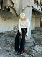 Broken seam occult street joggers with exposed frayed stitching and mysterious occult motifs, merging relaxed jogger comfort with raw underground dark streetwear energy.
