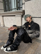 This dark urban layered faded cotton jacket features stacked construction and worn washed texture, delivering moody alternative streetwear vibes.