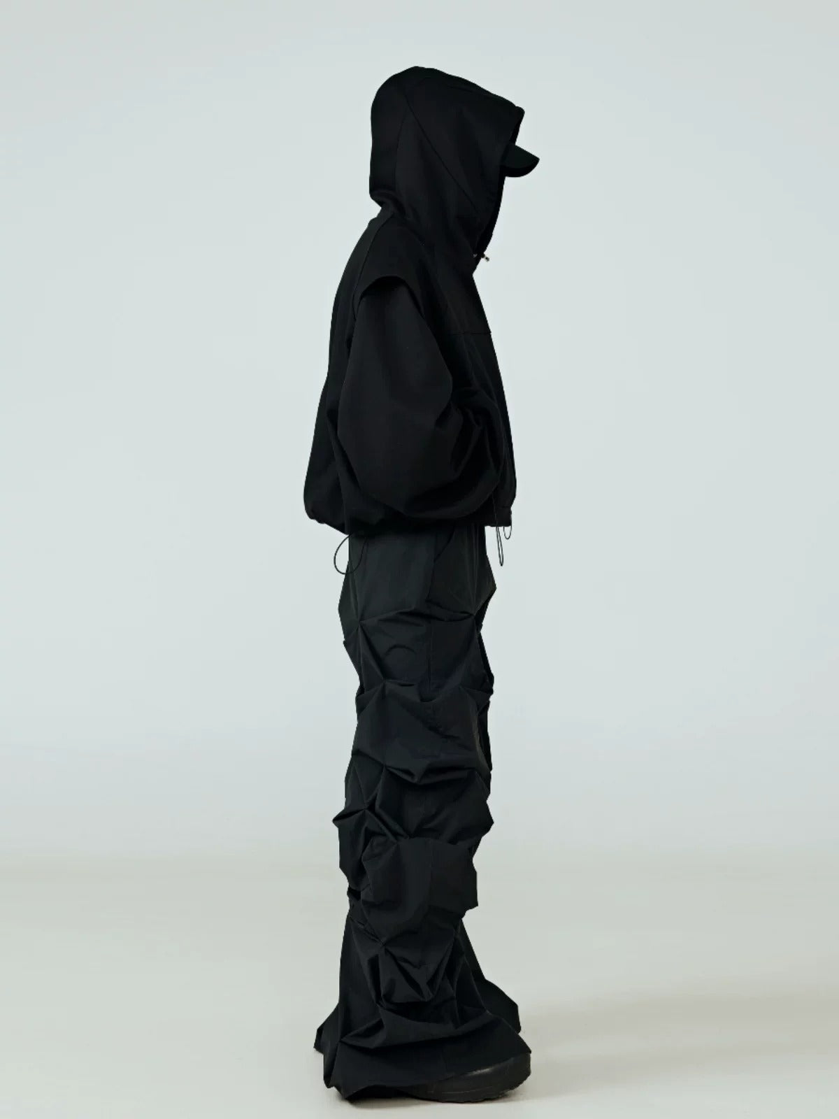 This dystopian oversized dark print jacket features dramatic dystopian themed graphics and a loose bulky silhouette, creating futuristic grim vibes for underground alternative outfits.