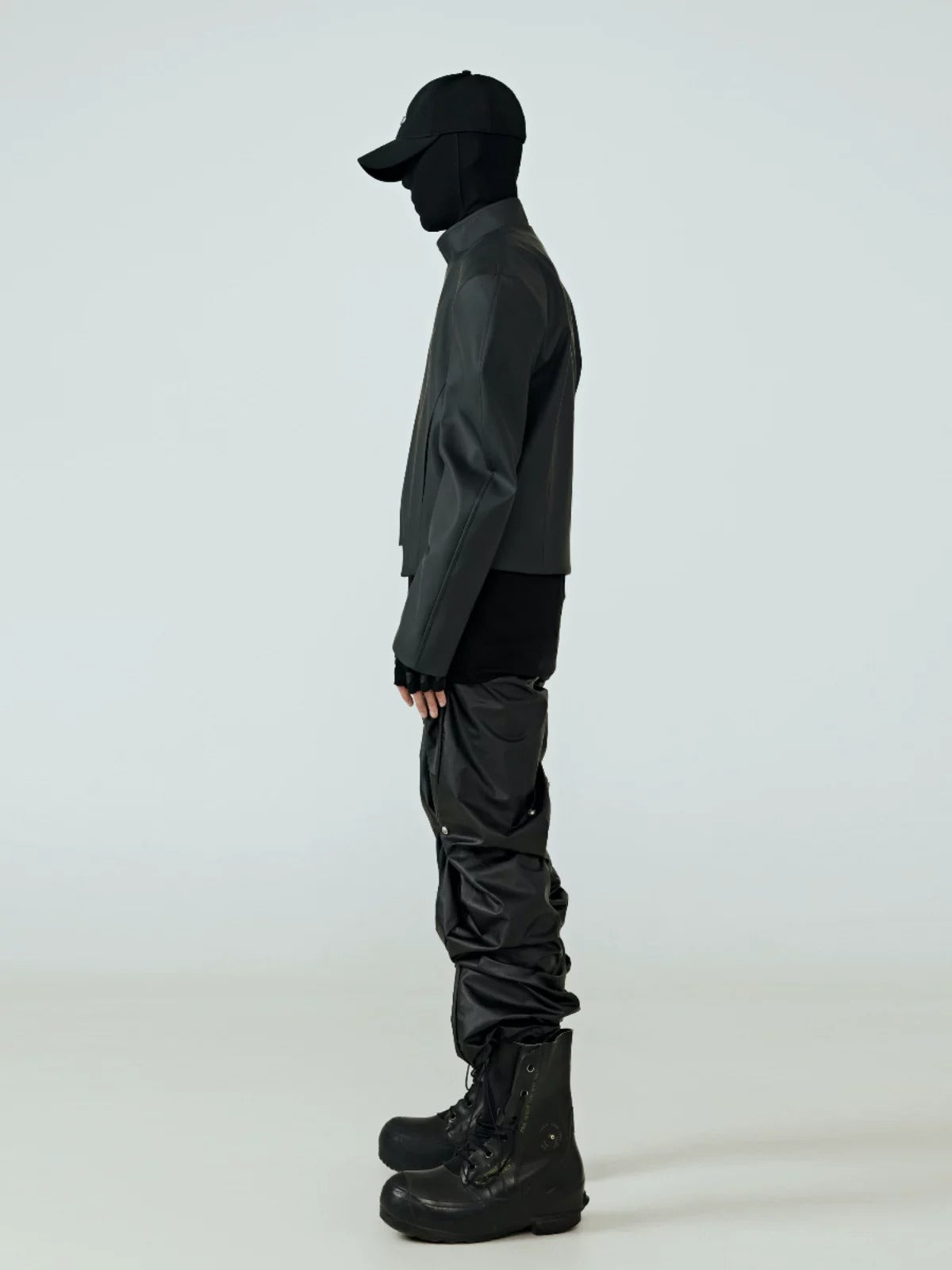 This dystopian raw-cut black outerwear delivers bold deconstructed aesthetics for underground street styling.