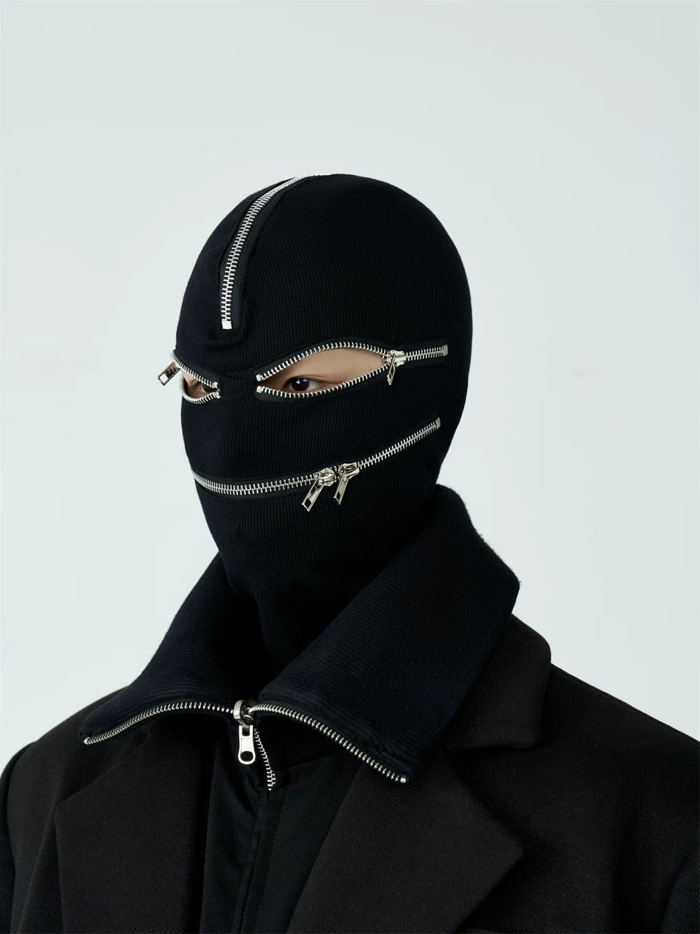 Frayed edge black alternative longshirt with raw unfinished hems and loose extended cut, boasting rugged worn texture ideal for moody dark street layering.