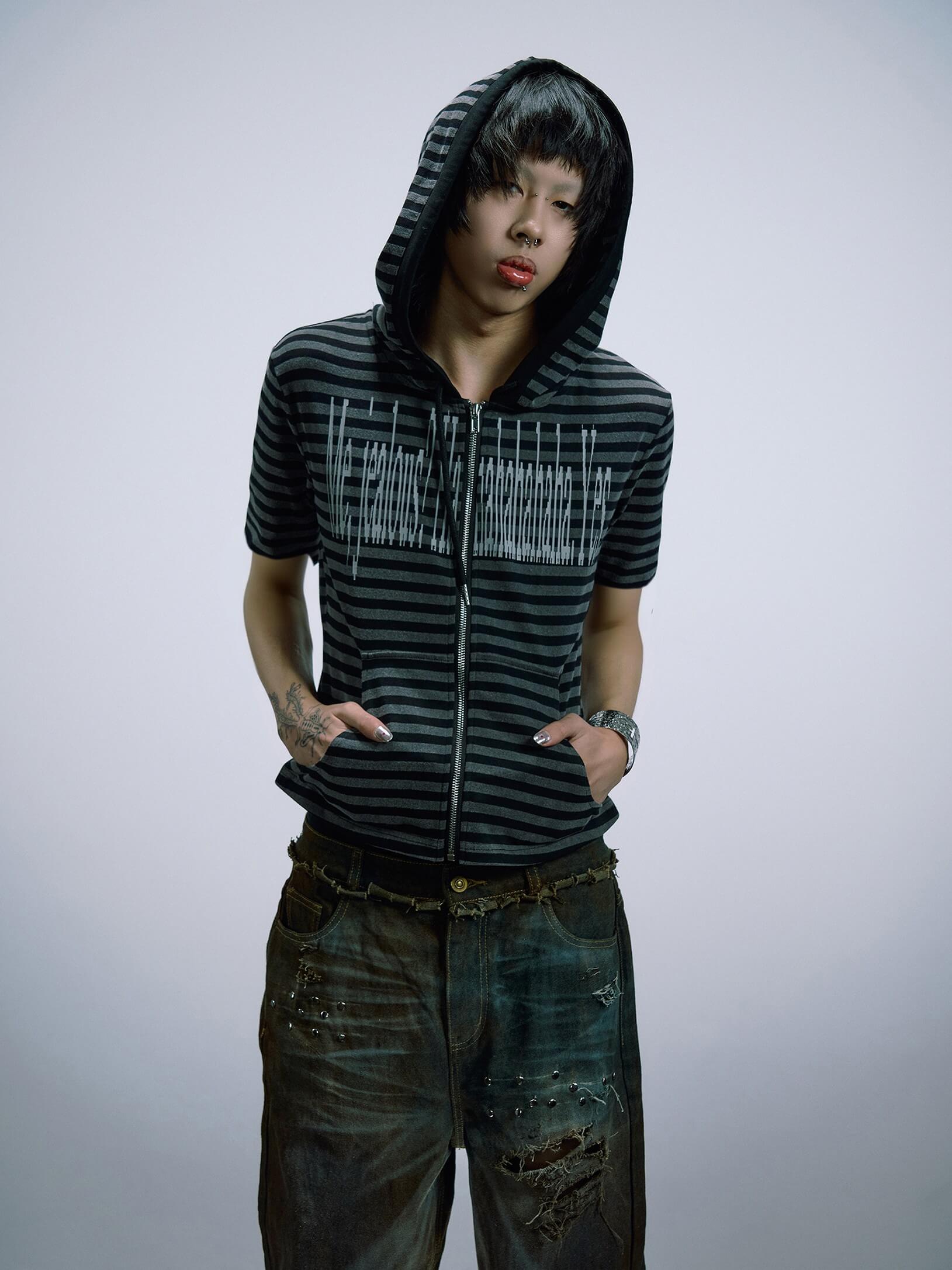 dynamic glitch‑graphic prints cover this edgy hip‑hop tee. Distorted visual patterns combine with a loose‑fit cut to bring bold urban hip‑hop street‑wear aesthetics.