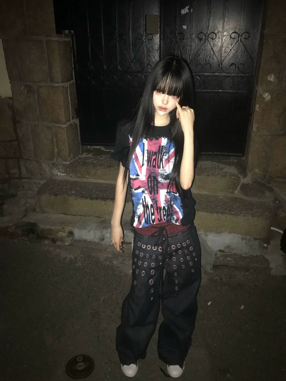 Vibrant holographic-shine fabric shapes this y2k cropped outfit. Iridescent color-shifting finish and short cropped cut deliver nostalgic futuristic flair for eye-catching cyber streetwear looks.