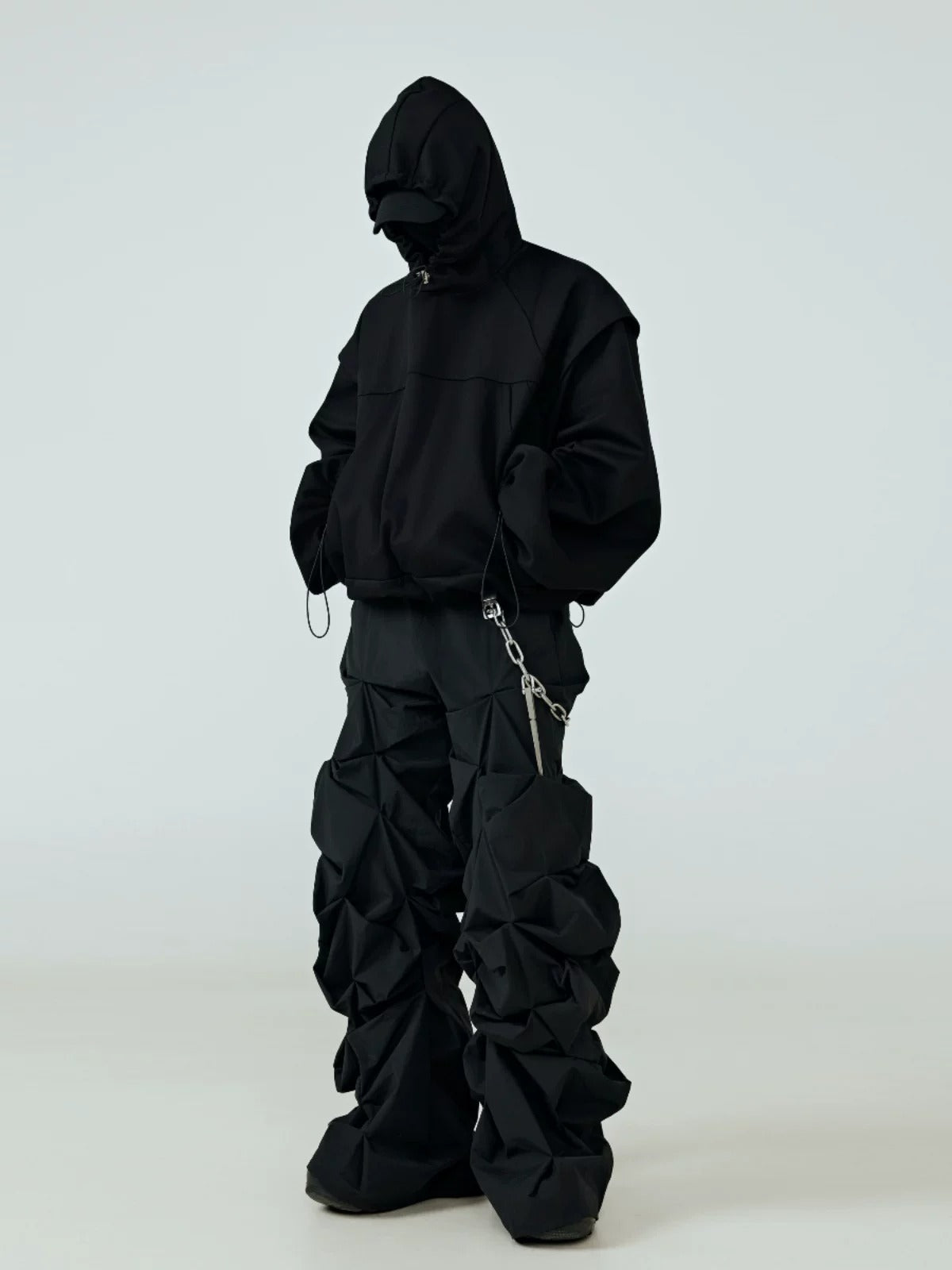 These nihilist worn-dye baggy trousers showcase faded uneven dye finish and a slouchy baggy silhouette, embodying somber underground alternative street vibes.