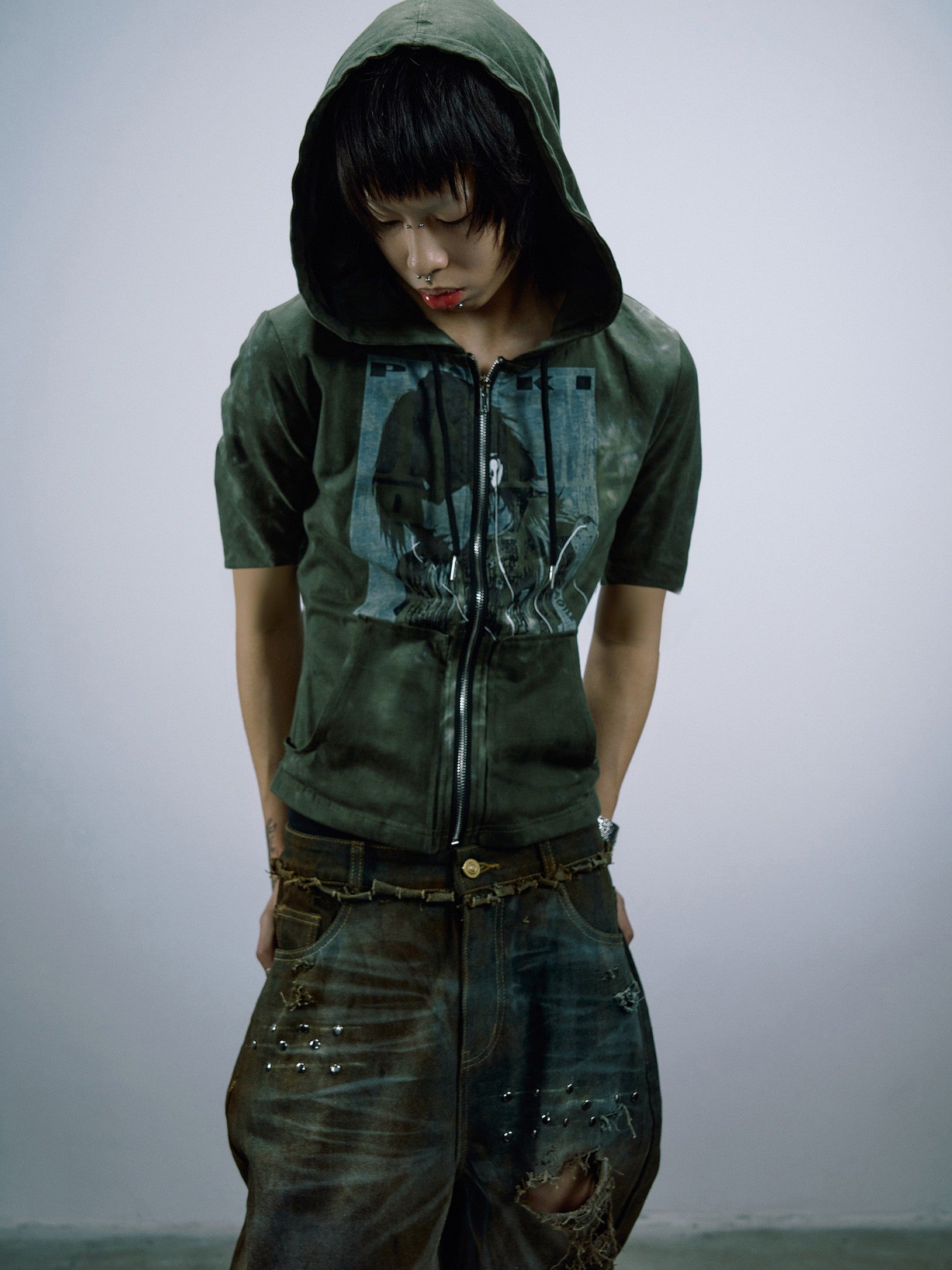 hand‑sewn patched‑fabric panels build this reworked grunge garment, with mixed‑textile splicing details to create rugged one‑of‑a‑kind aesthetics for alternative street‑wear styling.