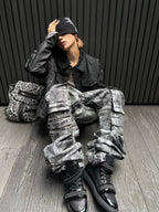 This rebel-style layered black graphic hoodie blends edgy prints and stacked detailing for a striking street look.