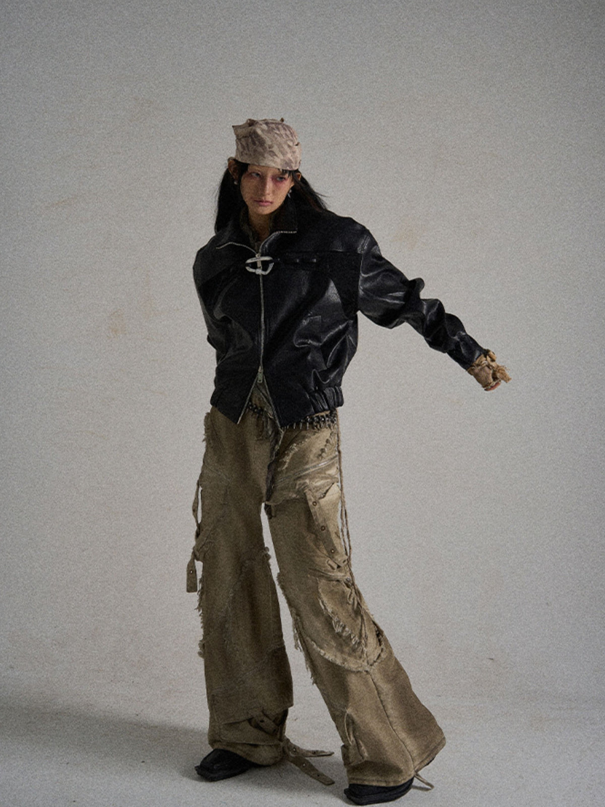 Ripped-panel urban street cargo shorts are designed with torn fabric panels and multi utility pockets, highlighting rugged and eye-catching city street aesthetics.