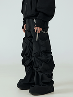These rough-stitched black slouchy shorts have exposed rugged stitching details and a relaxed slouchy cut, bringing raw underground vibes for dark alternative outfits.
