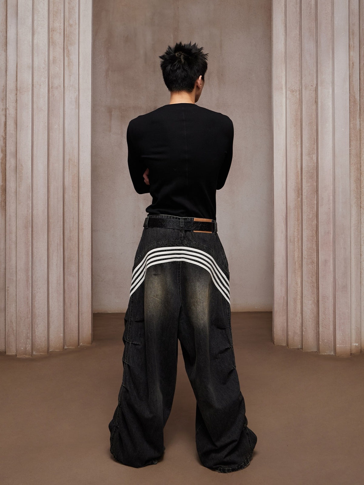 Street culture jogger pant with pigment spray carries mottled spray wash effects and a tapered relaxed fit for authentic urban street flair.