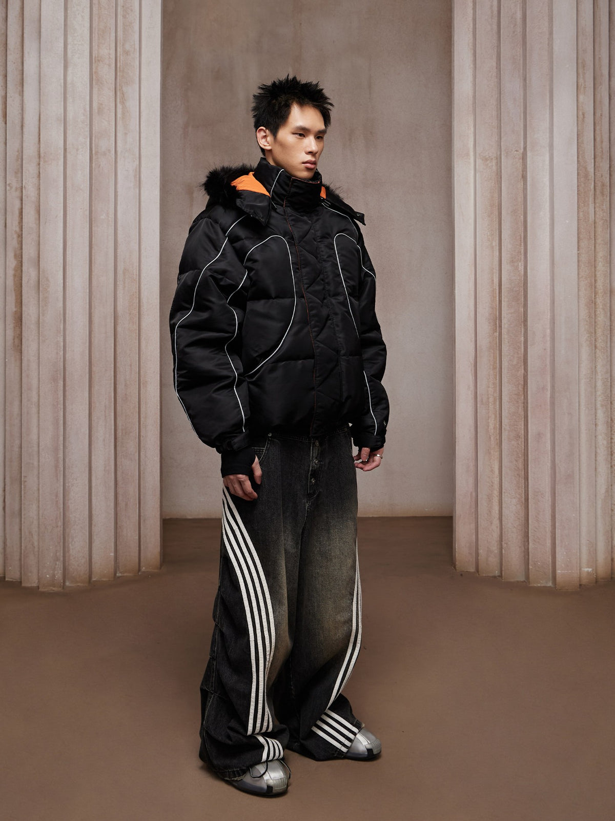 Tech cargo short with chrome hardware combines multi-pocket utility and shiny metallic accents for futuristic street-ready styling.