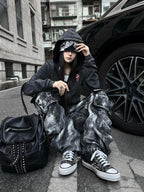 This underground-style faded black outerwear boasts worn-in tones and a moody silhouette for alternative street aesthetics.